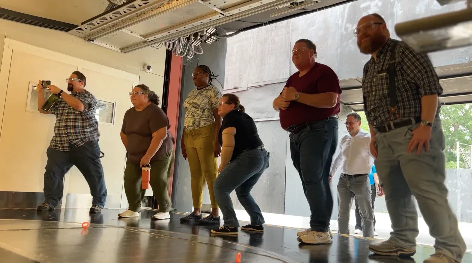 Teachers standing inside the UF’s wind hazard experimental facility