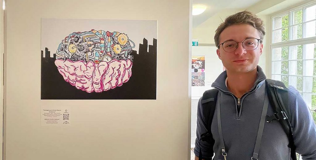 UF engineering student Matheus Kunzler Maldaner poses near his art displayed as part of the Heidelberg Laureate Forum.
