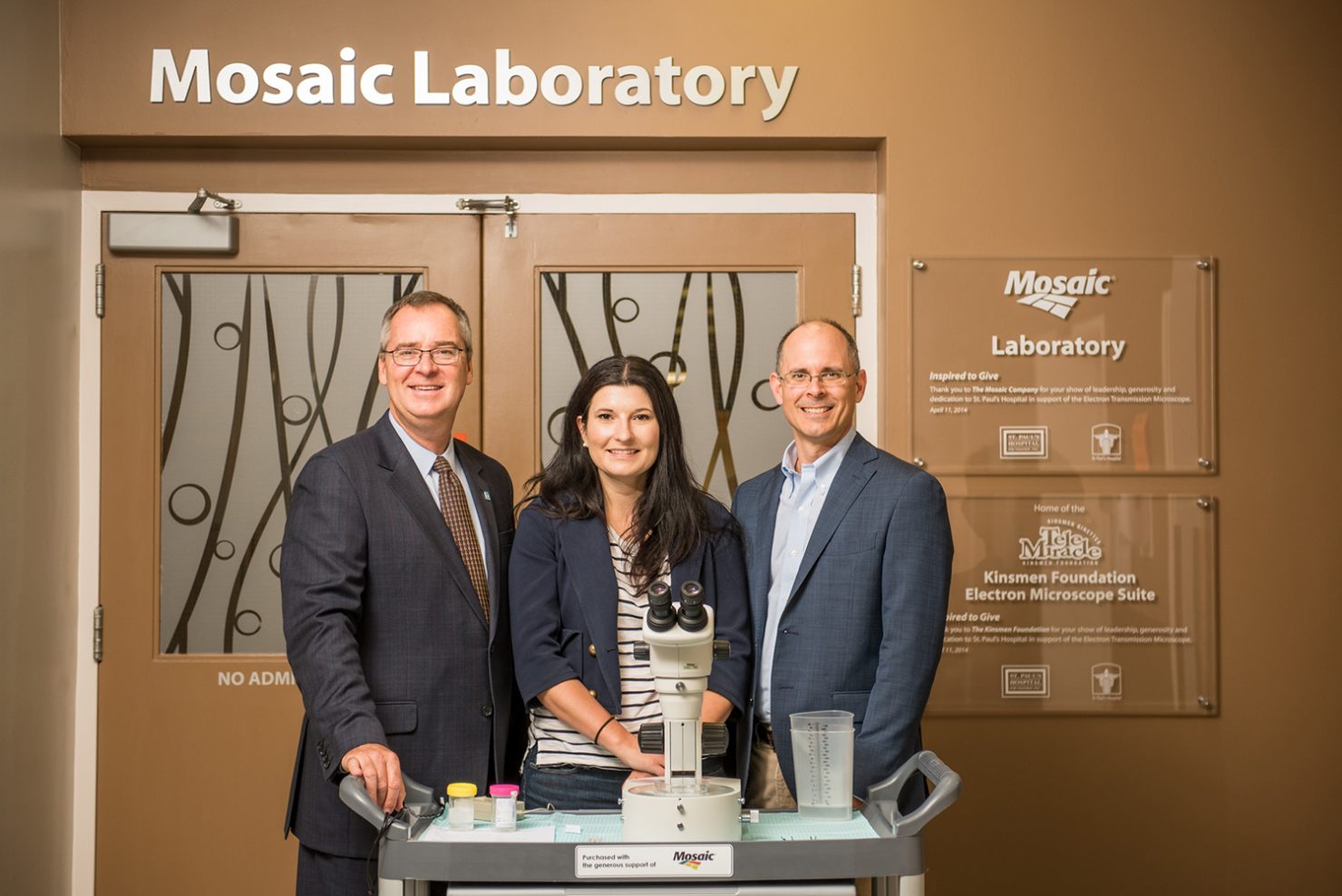 SPH Foundation CEO Bruce Acton with Mosaic Senior Director of Public Affairs Sarah Fedorchuk and Mosaic Senior Vice President Bruce Bodine at the entrance to the Mosaic Laboratory at St. Paul’s Hospital (Saskatoon, Saskatchewan), which was funded by the company’s philanthropy.