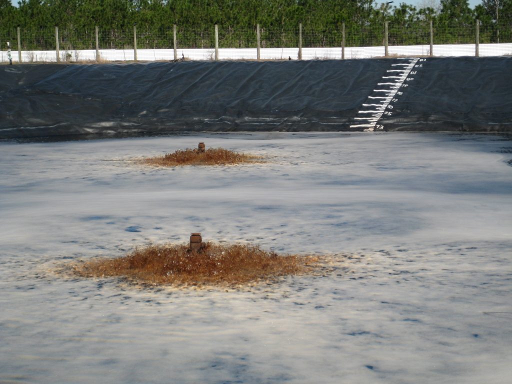 Leachate results from the interaction of rainwater and landfilled solid waste, and geomembrane-lined lagoons, such as the one shown here, are often used to store and treat leachate.