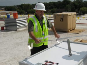 Bollinger shown with solar construction materials.