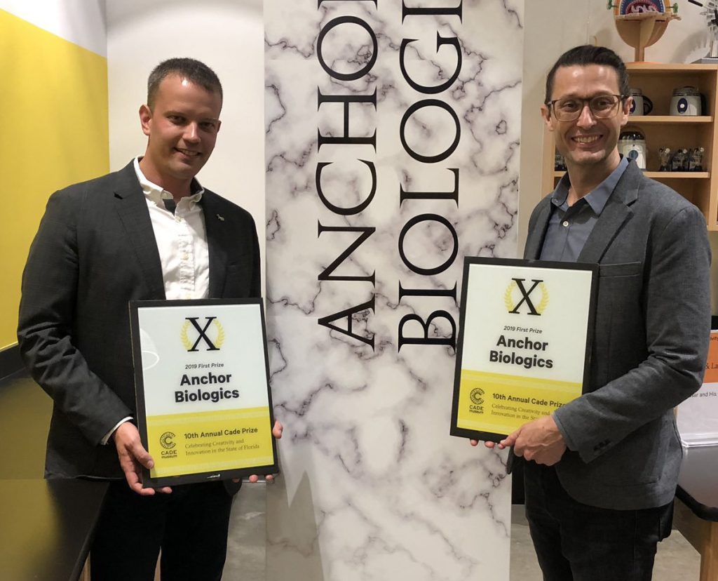 The Anchor Biologics team, Dr. Benjamin Keselowsky, professor, and Dr. Gregory Hudalla, assistant professor, accepted the $25,000 Cade Prize award.