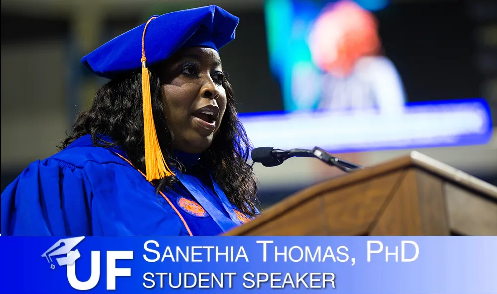Dr. Thomas speaking at podium