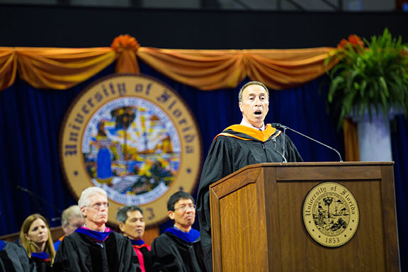 Khalid Metnak speaking at podium