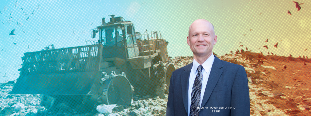 Dr. Townsend with landfill in the background