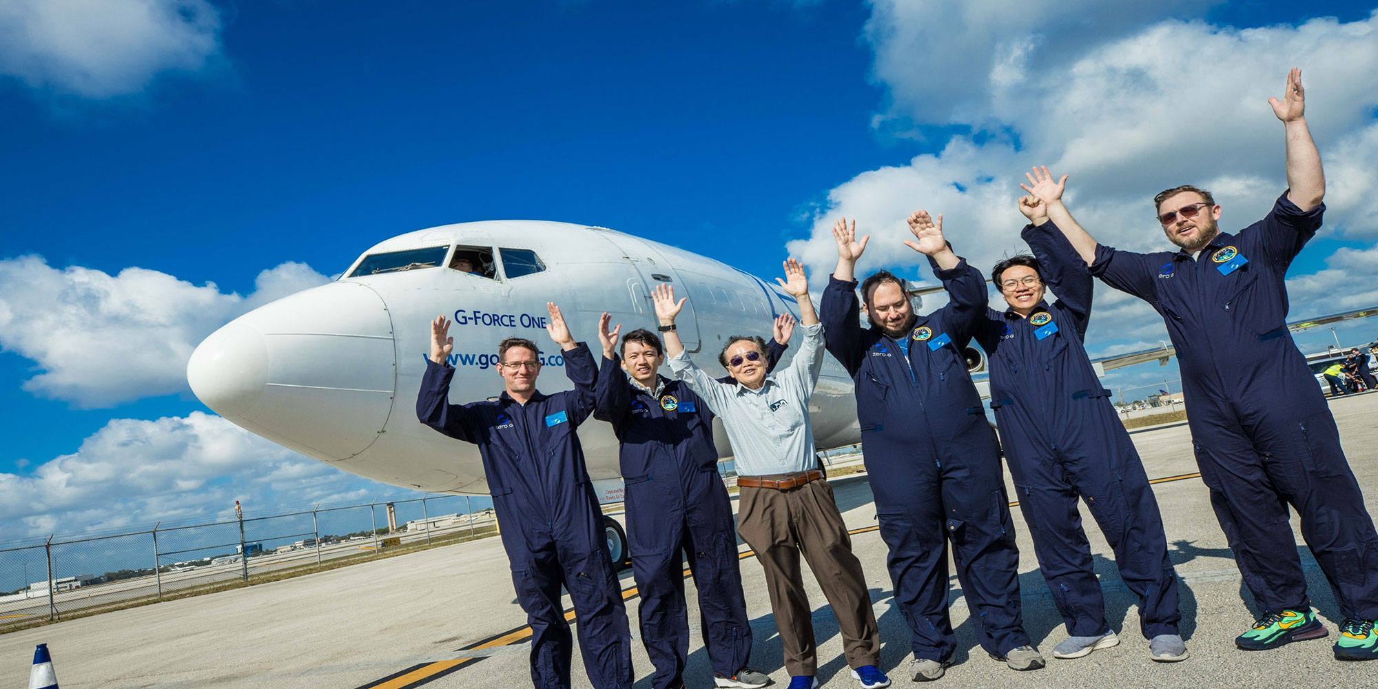 The UF 2024 Flight Team poses with an aircraft that flies a parabolic trajectory to simulate a microgravity environment.