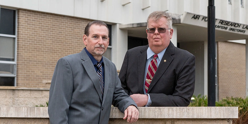 Richard Vigeant (left), Director of the University of Florida’s Applied Research in Engineering program along with David Bragg, FLARE’s National Security Program Area Lead, helped create a collaborative research space for AFRL. (Photo: EdTech)