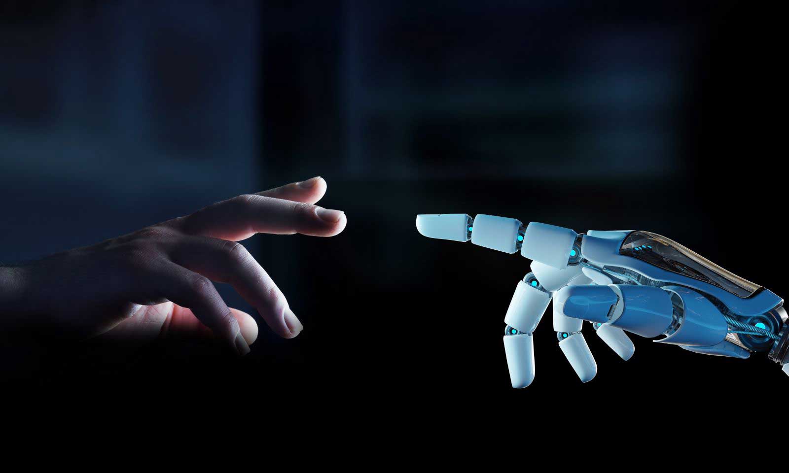 A human hand reaches toward a robot hand on a dark background.