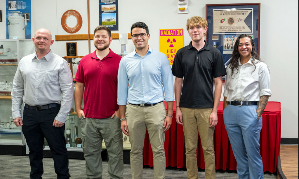 UF PH.D. candidate Enrique Medici, center, stands with his U.S. Air Force’s SMART Scholar Program classmates on June 26.