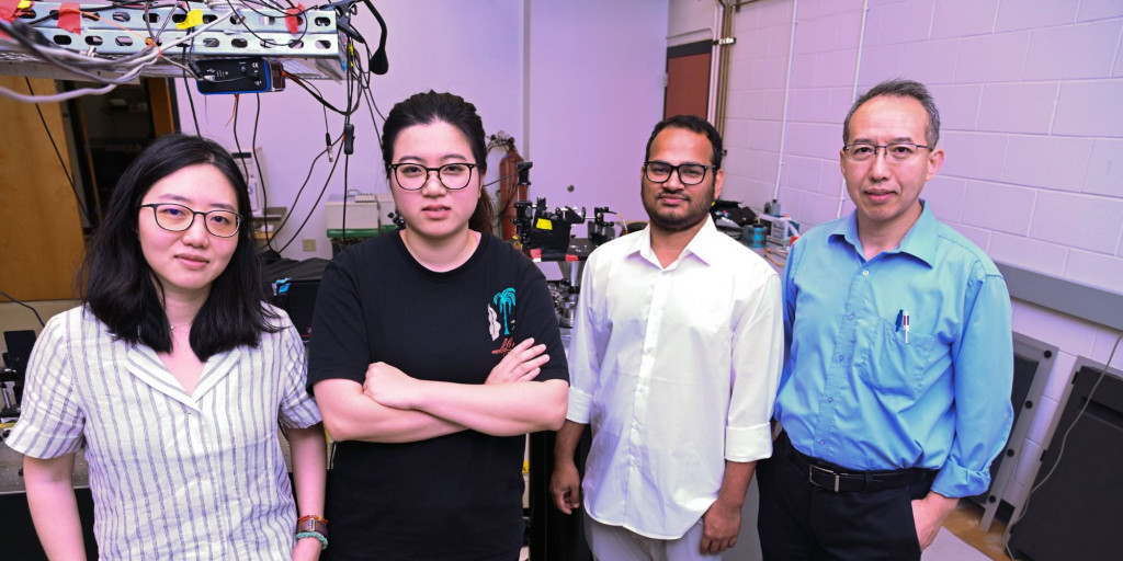 The researchers in Zhang’s lab in the New Physics Building at University of Florida. Left to Right: Xiao-Xiao Zhang (the lead PI of the study), Yunong Wang, Enamul Yousuf and Philip Feng.