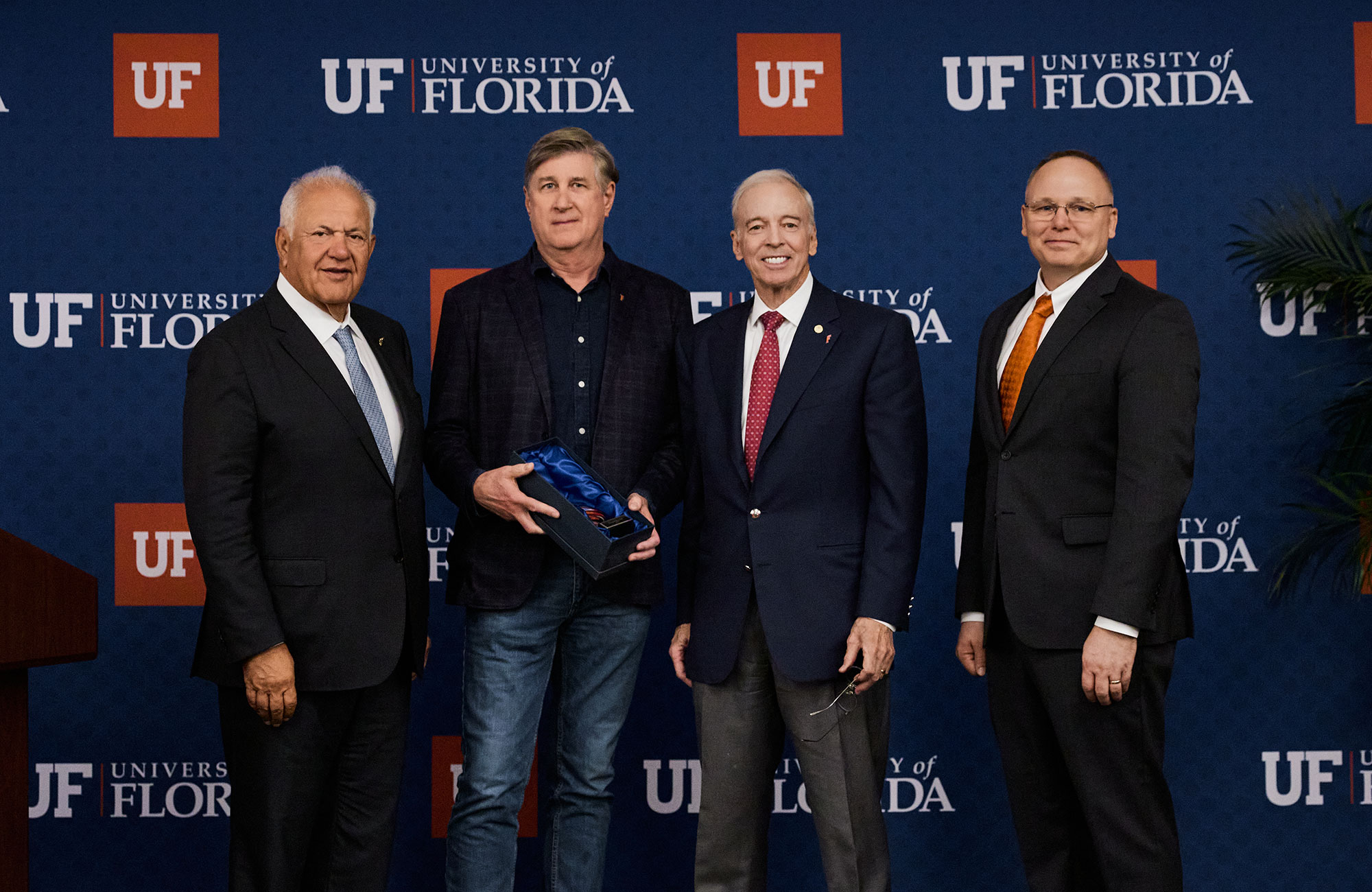 Read Hayes, second from left, poses with Board of Trustees Chair Mori Hosseini, left, UF Interim President Donald W. Landry and College of Engineering Interim Dean Warren Dixon Friday.