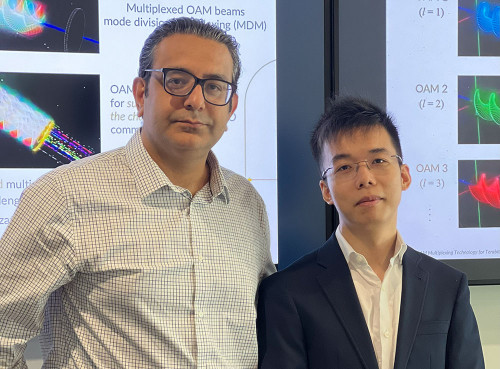 Hamed Dalir, associate professor of Electrical and Computer Engineering and director of UF’s Center for Heterogeneous Integration and Photonics (CHIP) Lab, is shown with UF ECE alumnus Jiachi Ye.