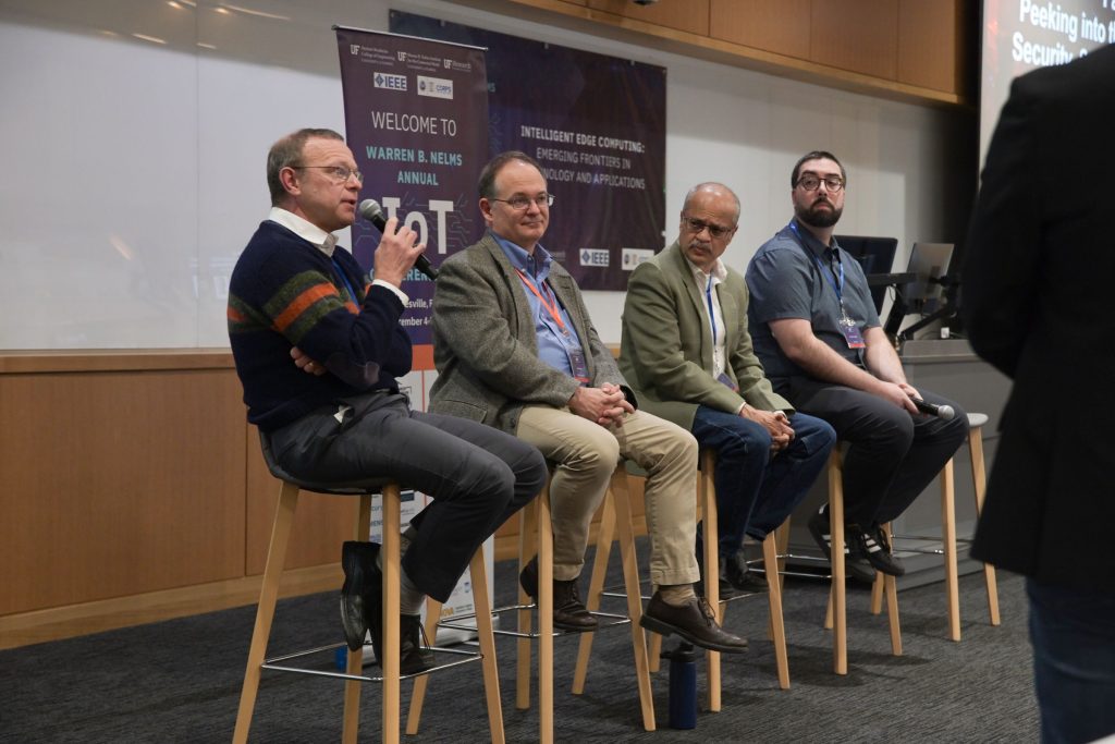 Panelists, from left, Thomas Wahl, Jon Mellott, Murtha Sadhasivan and Daniel Smullen speak about the future of Internet of Things technology on Dec. 4 at the IoT Conference at UF.