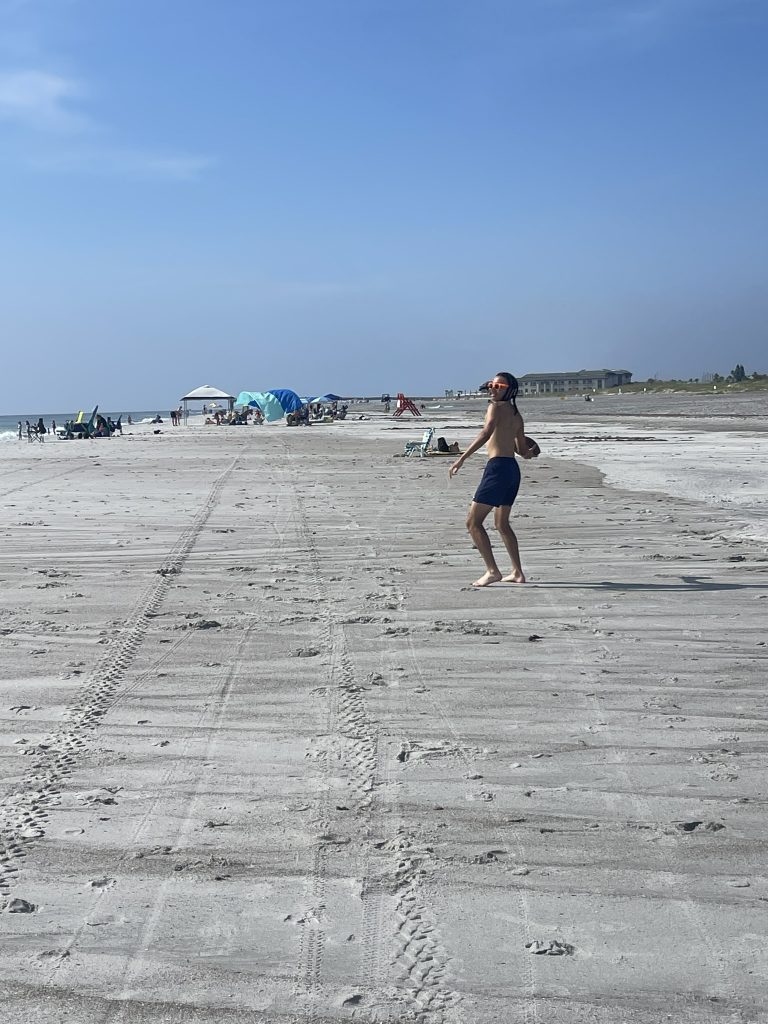 A student preparing to throw a football. 